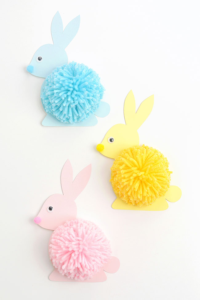 Blue, yellow, and pink pom pom bunnies