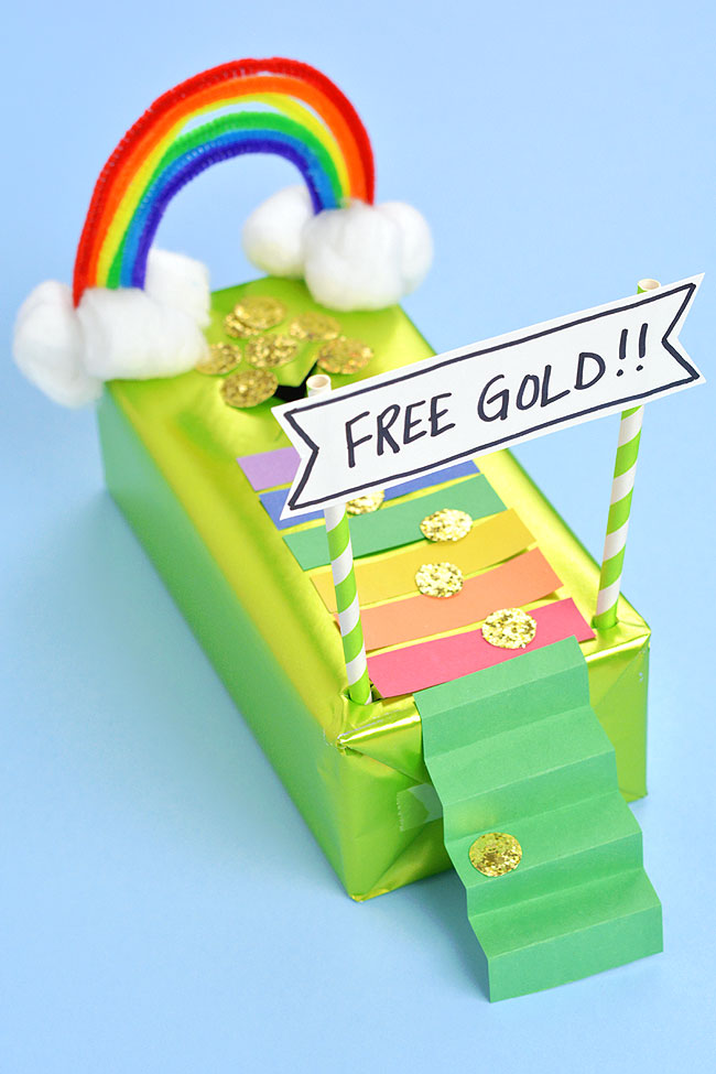 Leprechaun trap decorated with gold coins and a rainbow