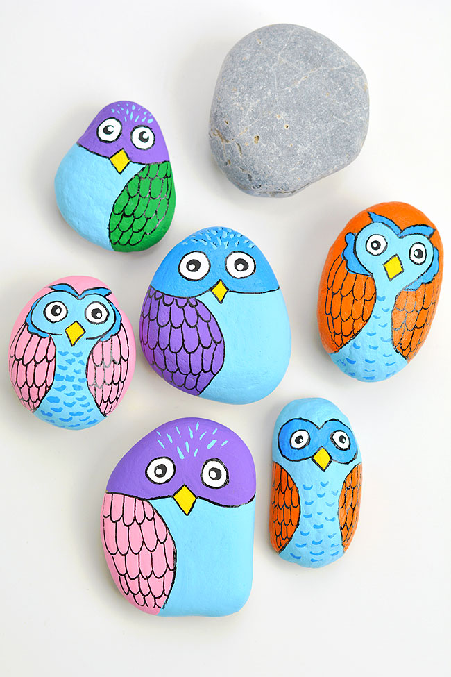 Group of rocks painted to look like owls