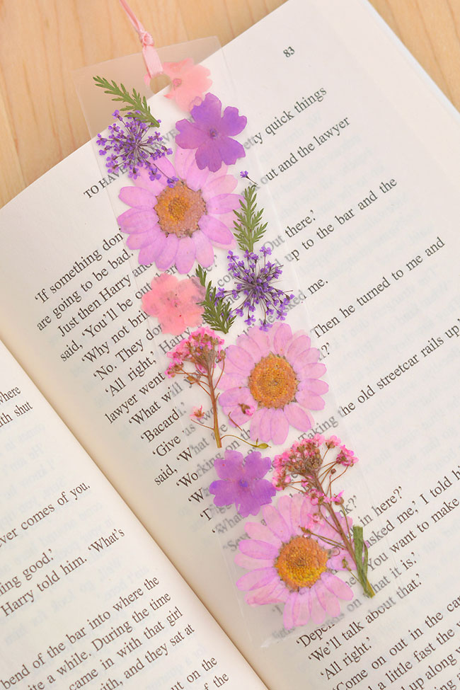 Pressed flower bookmark made with pink and purple dried flowers