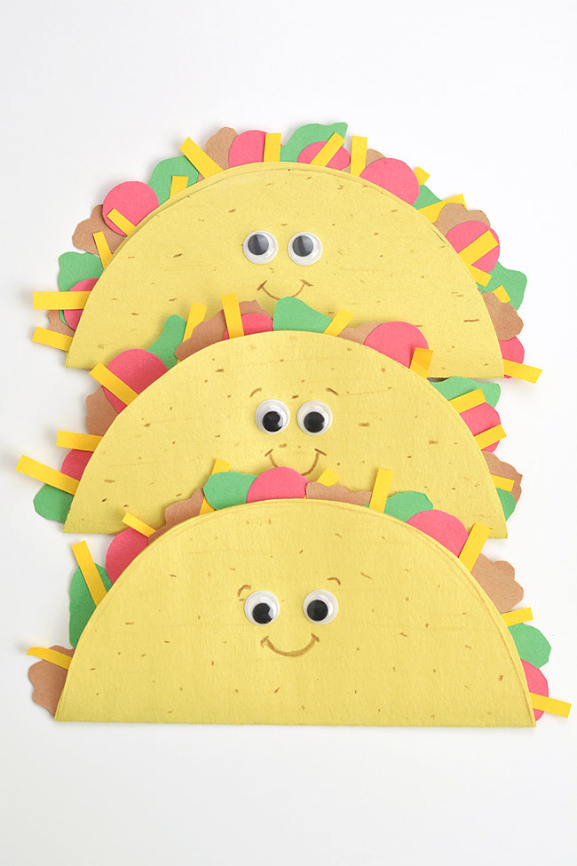 Three cute taco crafts lined up on a white background