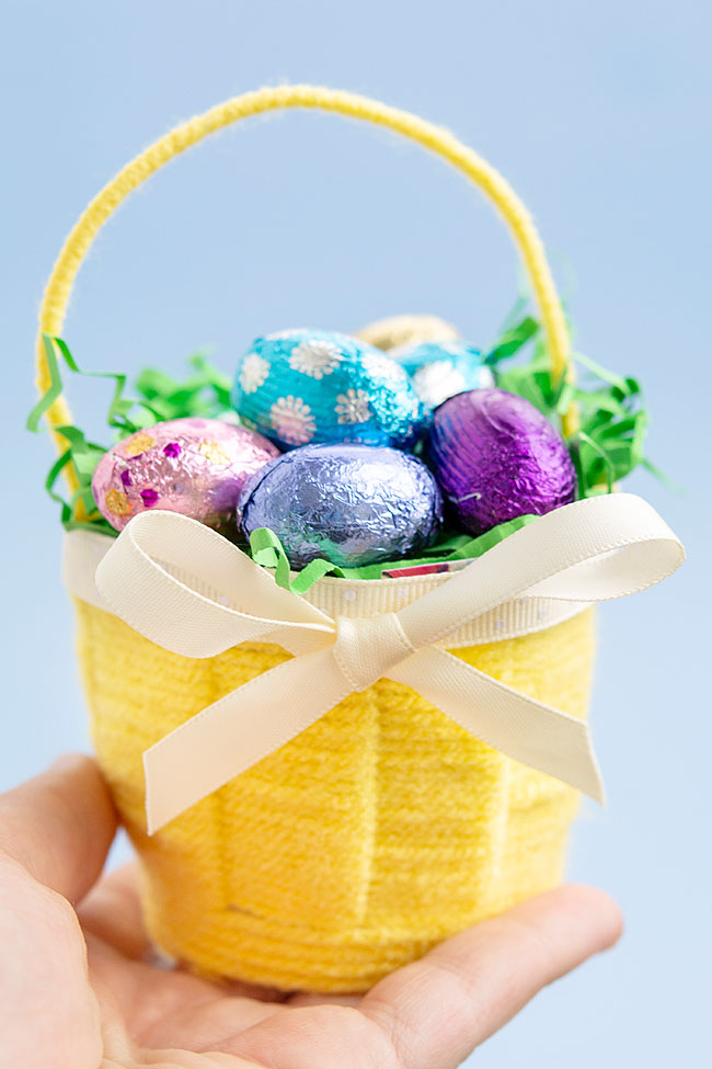 Yellow Easter basket craft held in a hand