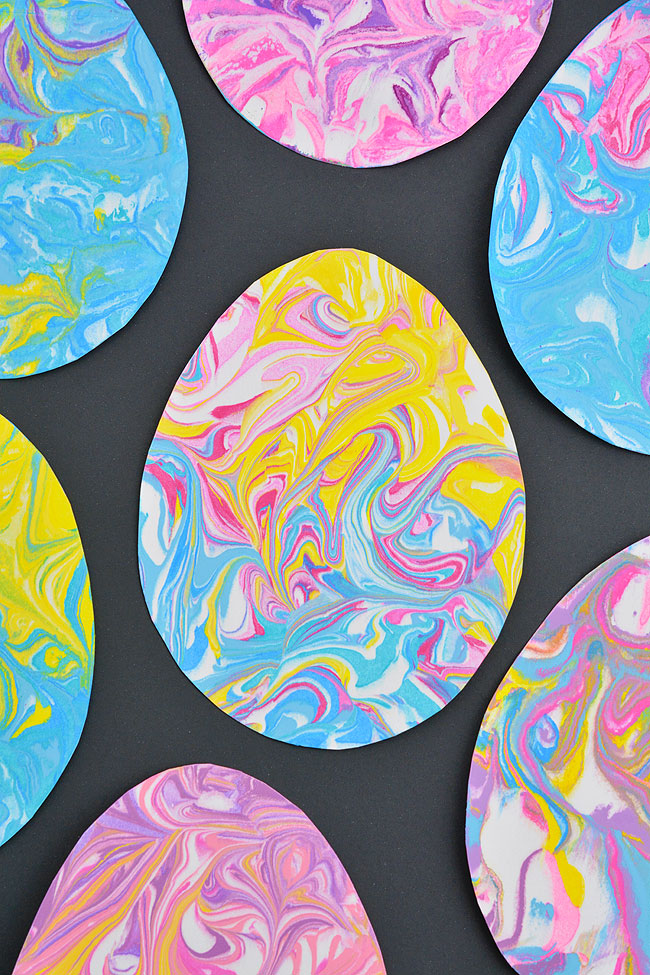Colourful marbled paper Easter eggs on a black background