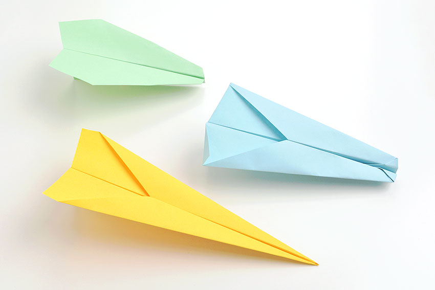 Three paper airplanes made with different designs