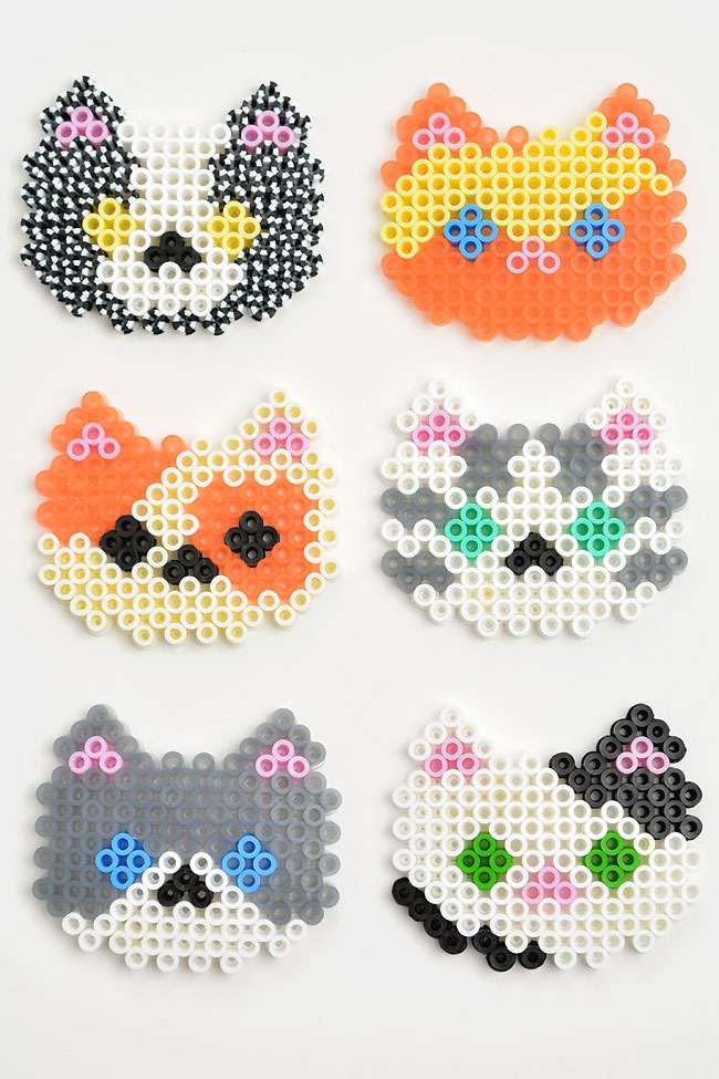 Six different cat patterns made from Perler beads