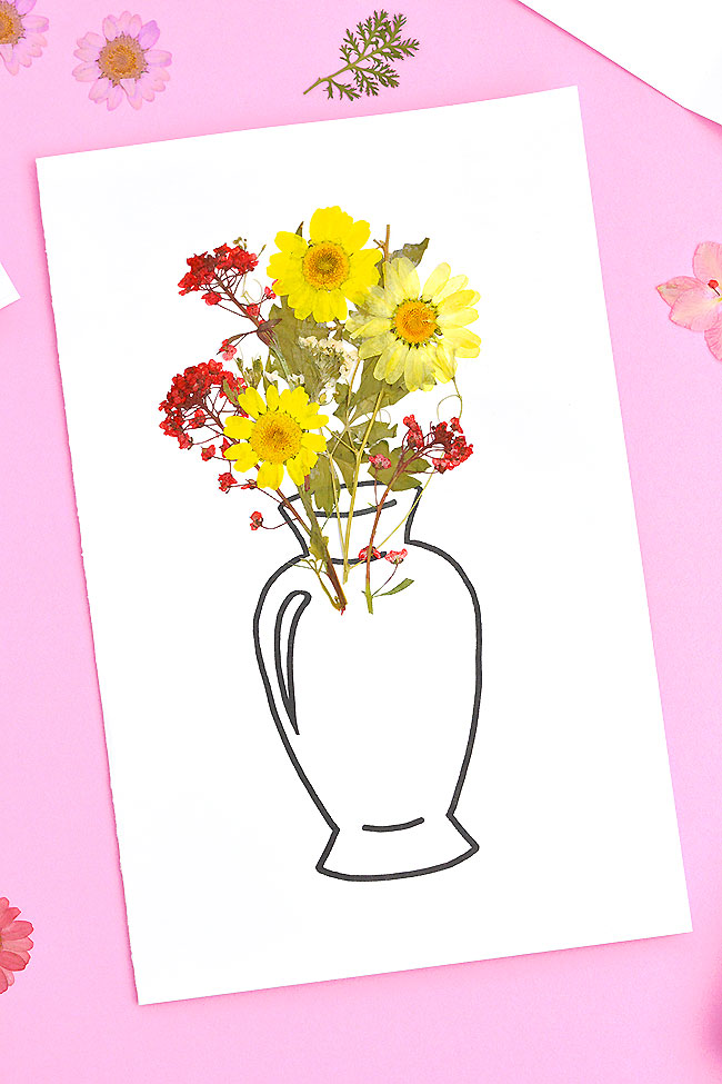 Homemade card with a vase and pressed flowers on it