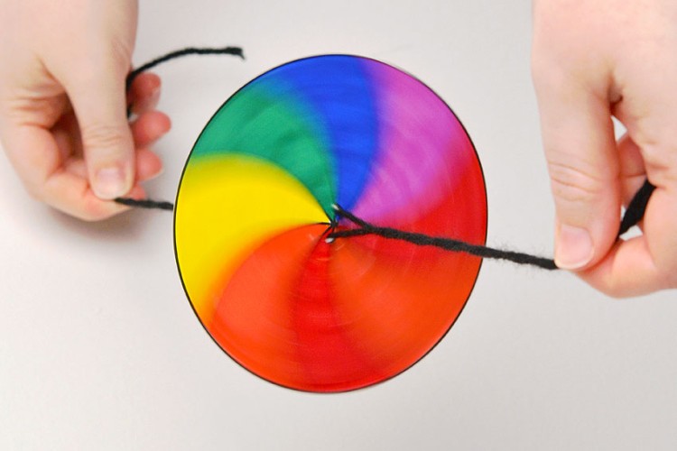Spinner toy with string