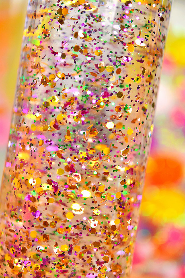 Closeup of a calm down jar filled with heart and star shaped glitter