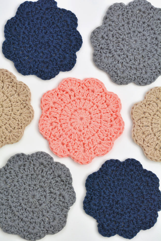 Crochet coasters made from an easy pattern, laid out on a white background