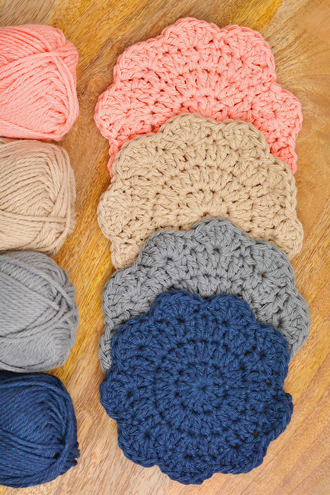 Crochet coasters with a flower petal scalloped edge