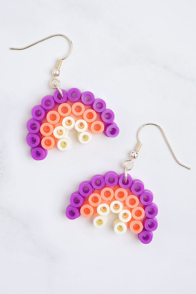 Rainbow shaped earrings made from Perler beads