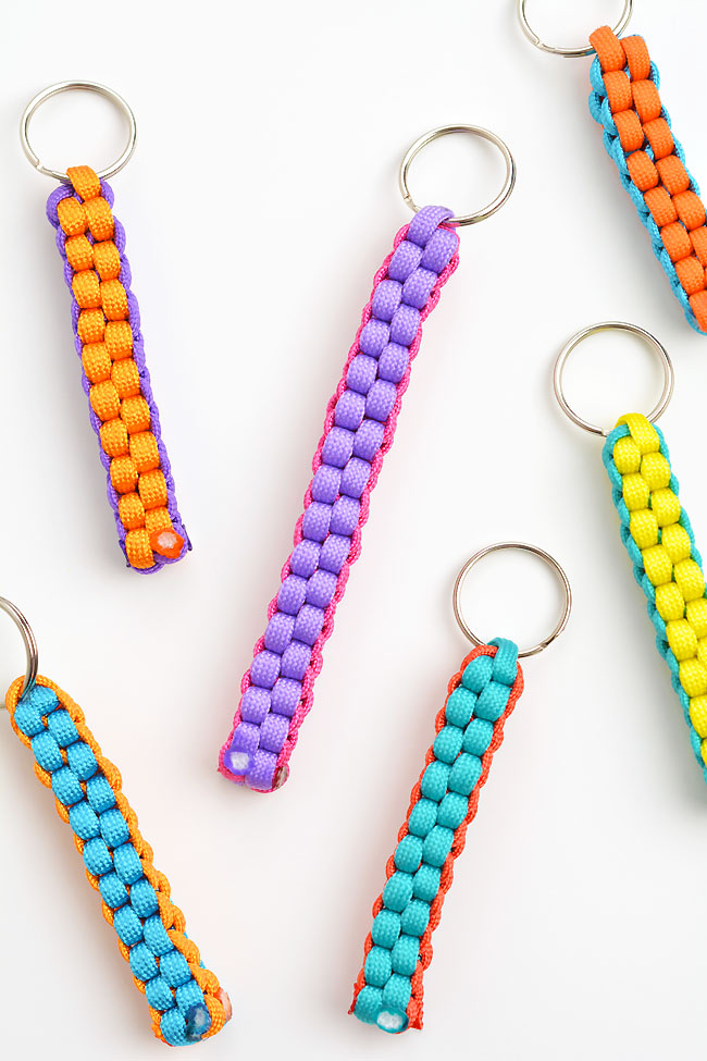 Group of DIY paracord keychains on a white background