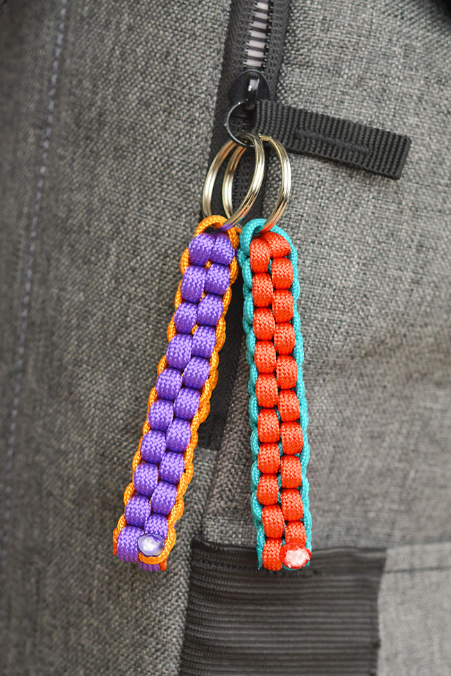 Paracord keychains hanging on a backpack as a zipper pull