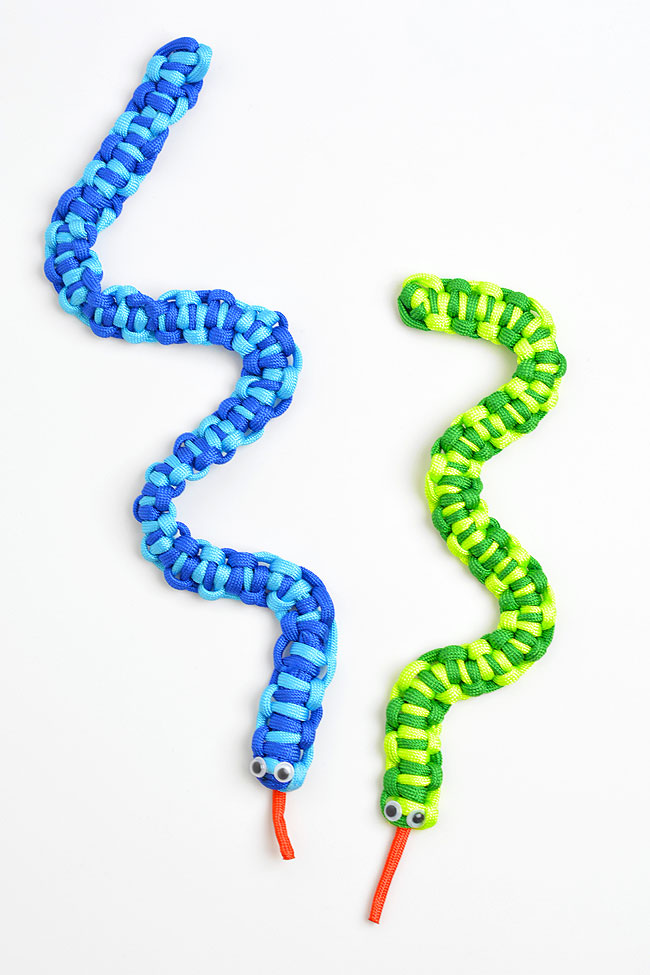 Green and blue toy snakes made from paracord