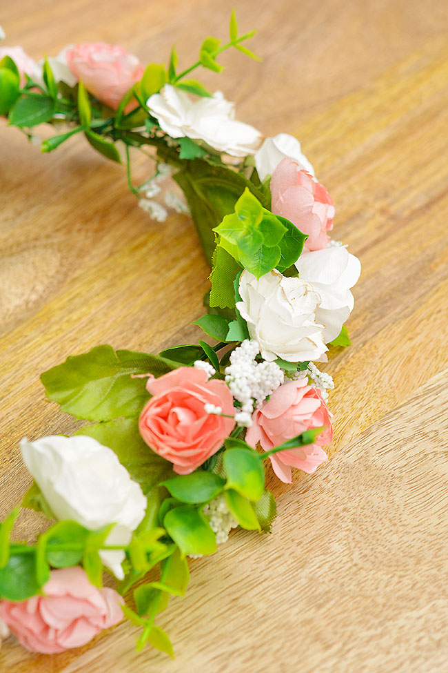 Flower crown with roses, greenery, and baby's breath