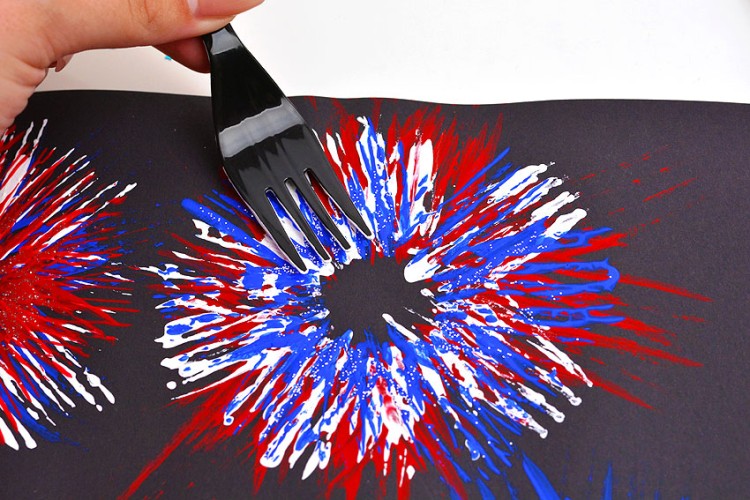 Use a fork to paint 4th of July fireworks