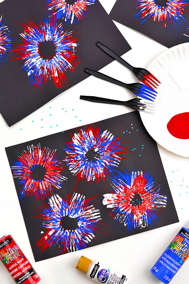 Red, white, and blue fireworks painted with a fork