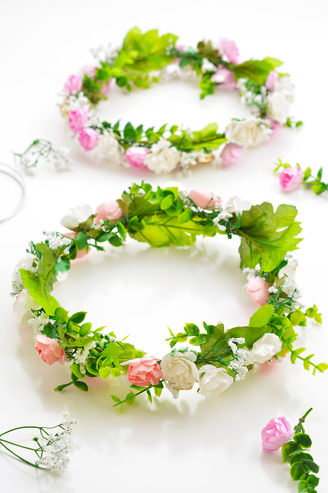 Two homemade flower crowns on a white background