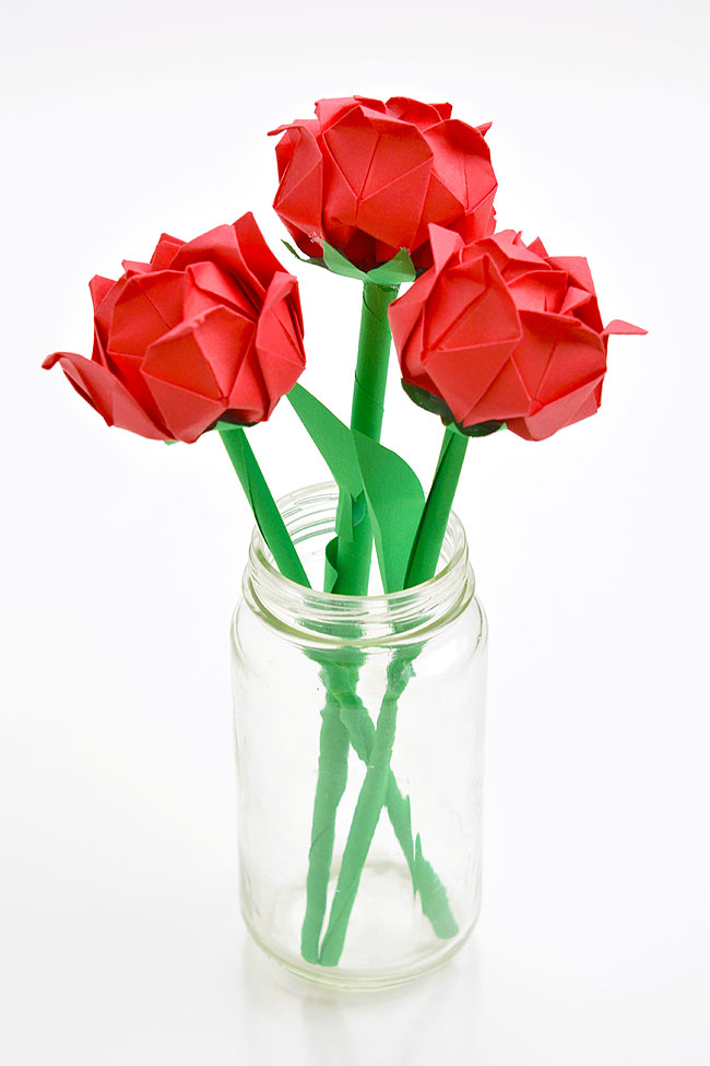 Group of DIY red roses made from folded paper