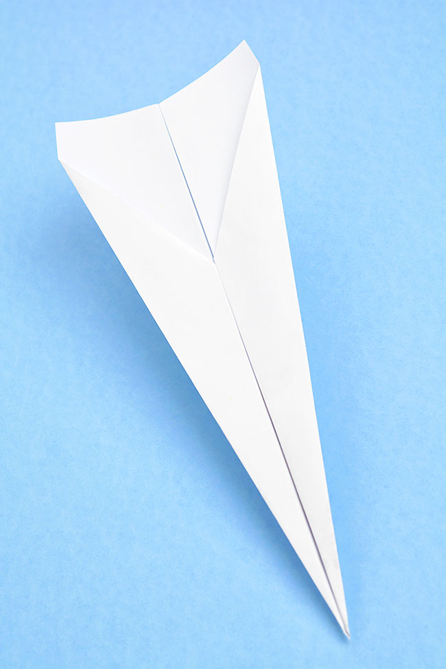 Paper airplane template folded into a paper plane