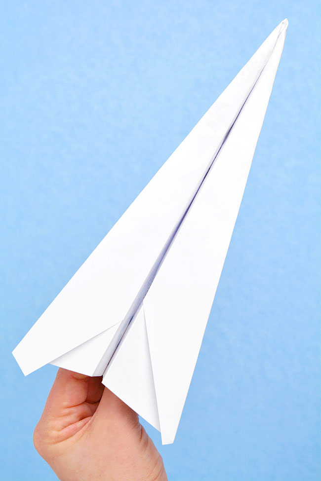 Fast and easy paper airplane template folded into a plane