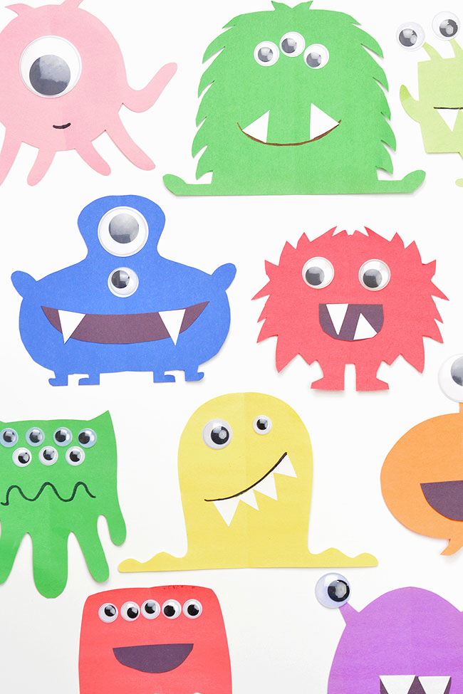 A group of monsters made with colourful construction paper
