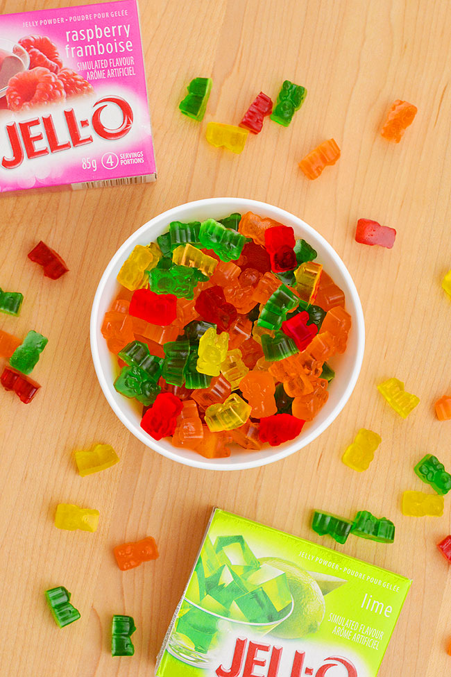 Homemade gummy bears sitting beside Jello boxes