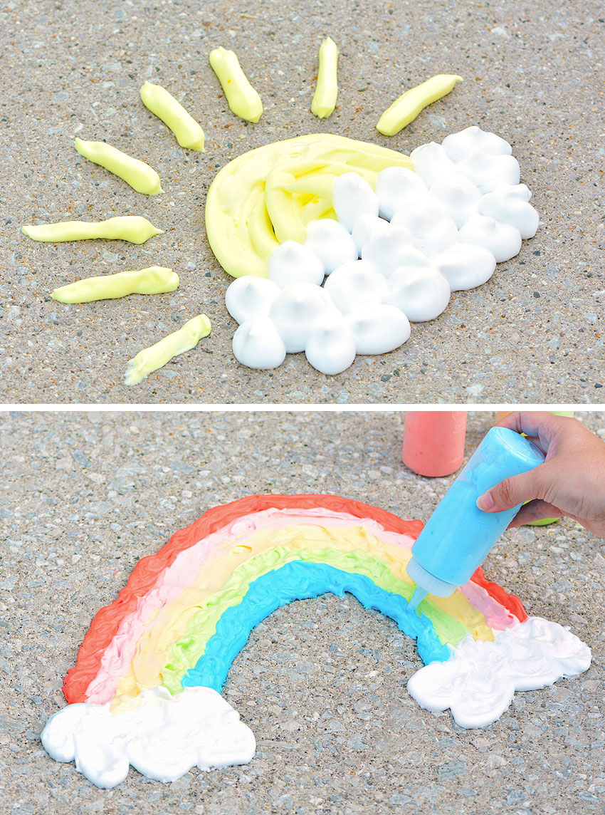 Painted sun, clouds, and rainbow on the sidewalk with puffy paint
