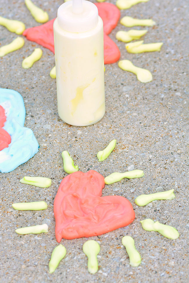 Painting hearts with sidewalk puffy paint