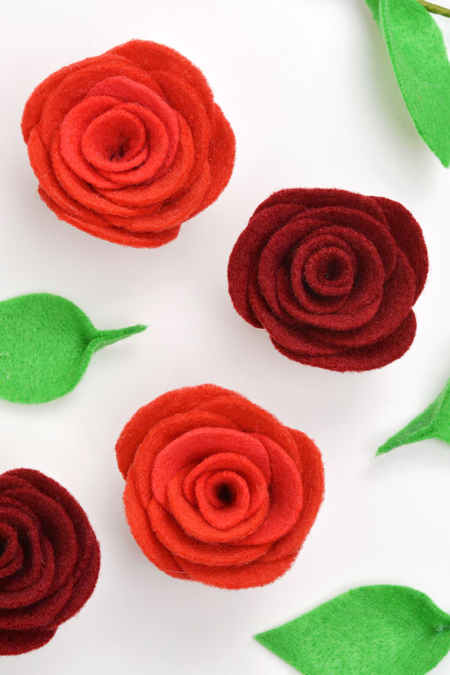 Felt rose heads and loose leaves without a stem