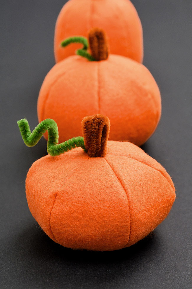 Felt pumpkins with pipe cleaner stems