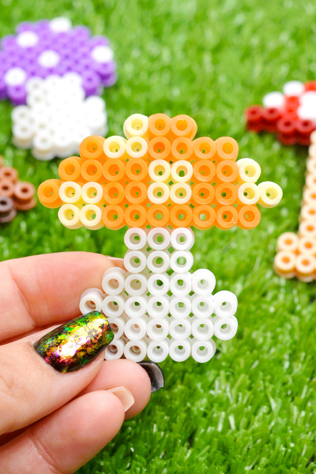 Trippy orange polka dot mushroom made from Perler beads