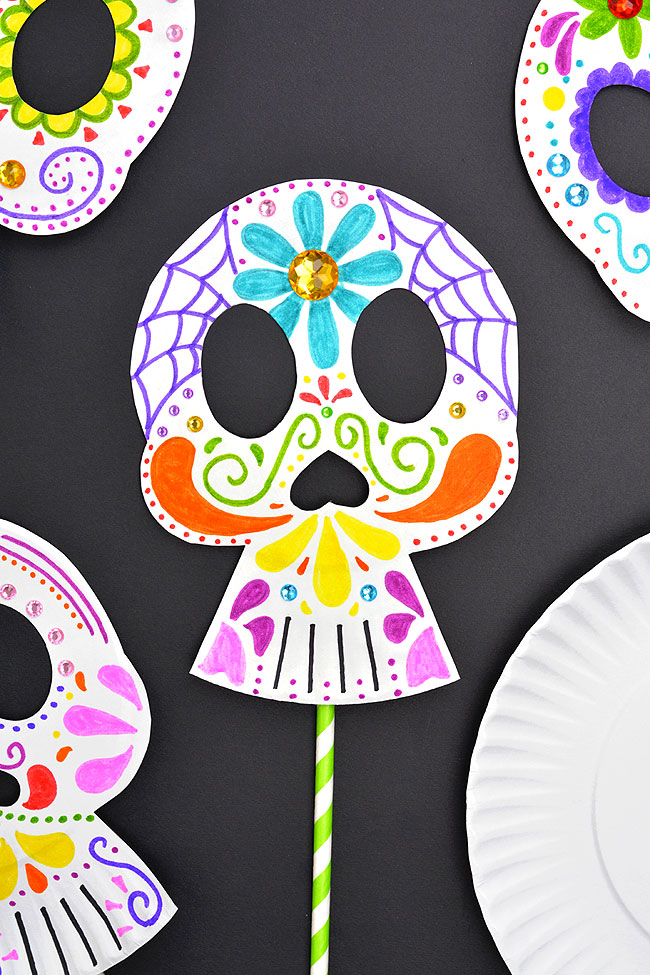 Day of the Dead mask made with a paper plate and coloured with markers
