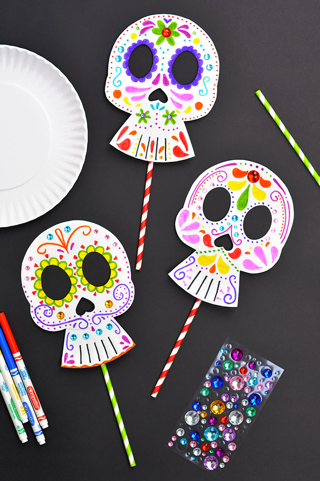 Different designs and supplies to make a Day of the Dead mask