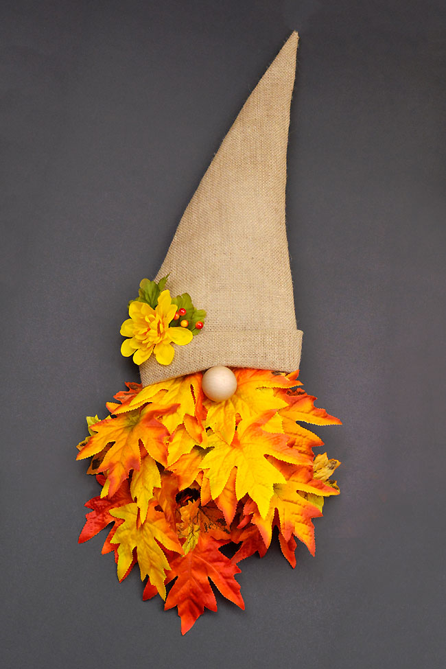 DIY fall gnome wreath on a dark background