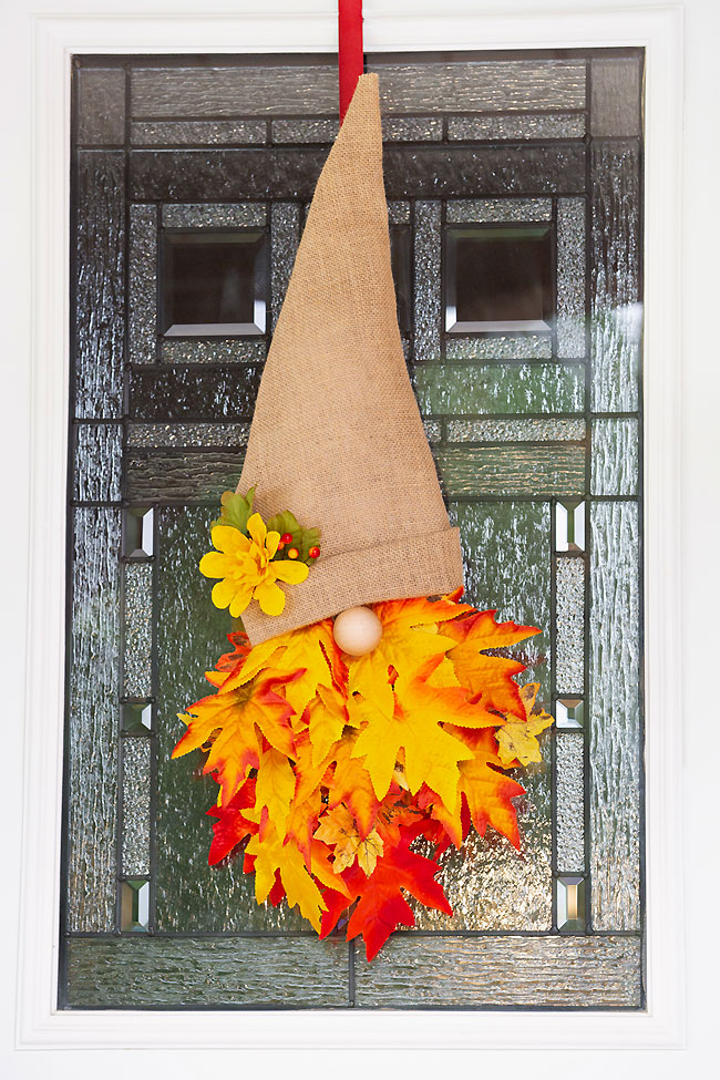 Fall gnome wreath hanging on a front door