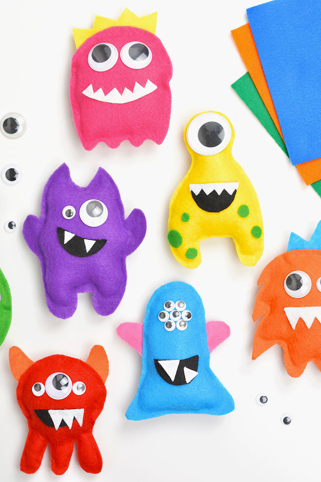 6 colourful felt monsters on a white background