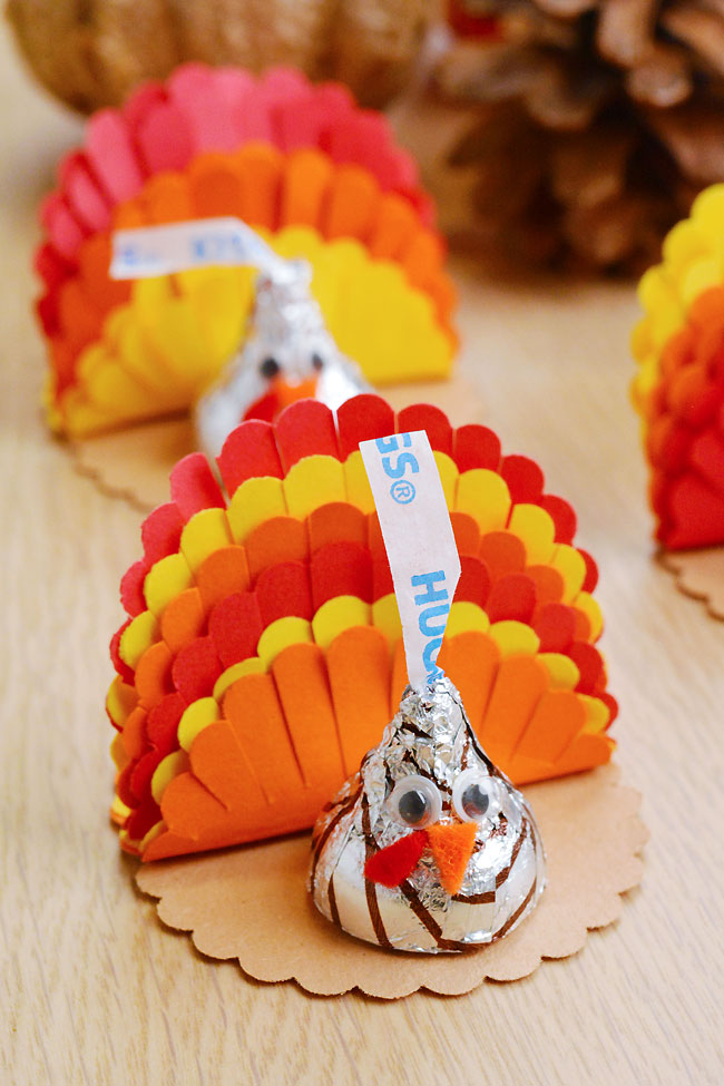 Turkey treat made with paper feathers and Hershey's Kisses