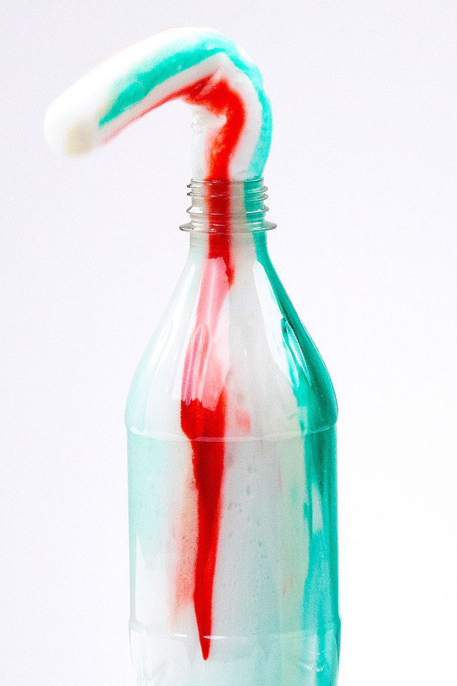 Foaming elephant toothpaste recipe shooting out of the clear bottle