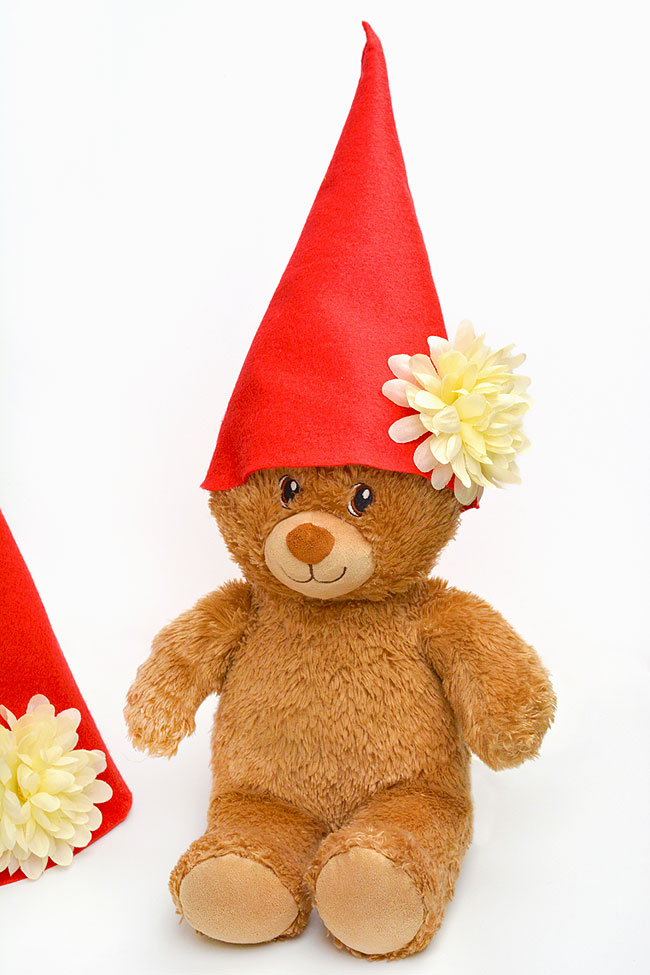 Teddy bear wearing a felt gnome hat