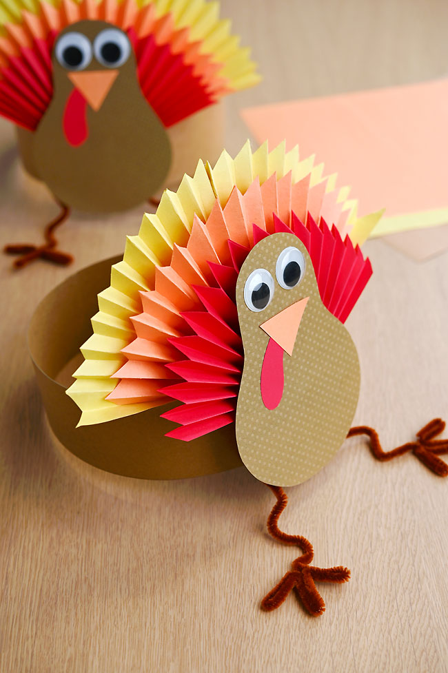 Turkey hats with colourful paper fan feathers