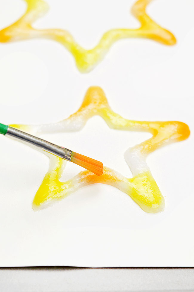 Painting on glue and salt shaped into a star