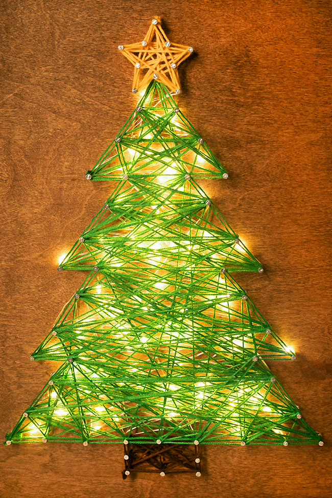 Closeup of lit up Christmas string art