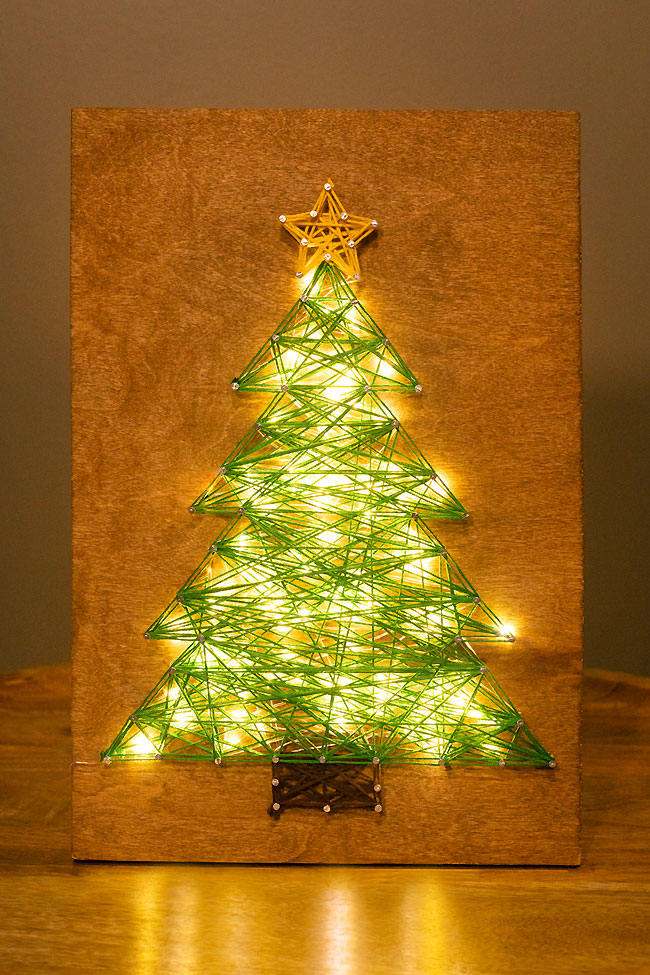 Christmas tree string art glowing with LED lights