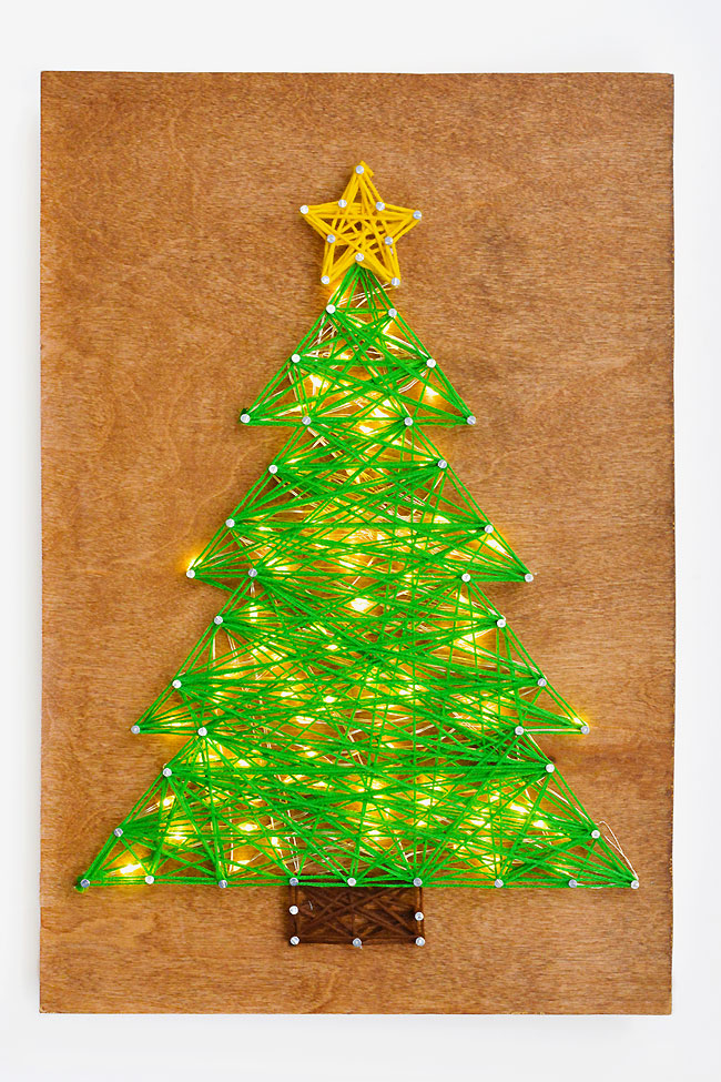 DIY String Art Christmas Tree on a white background