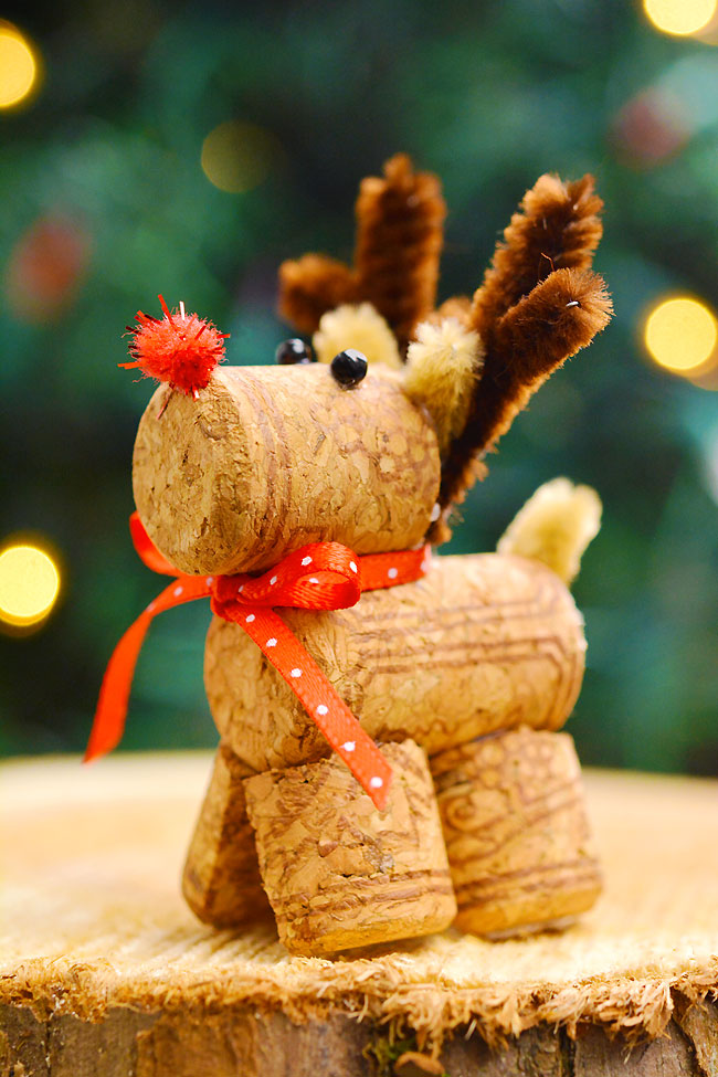 Wine cork reindeer in front of a Christmas tree
