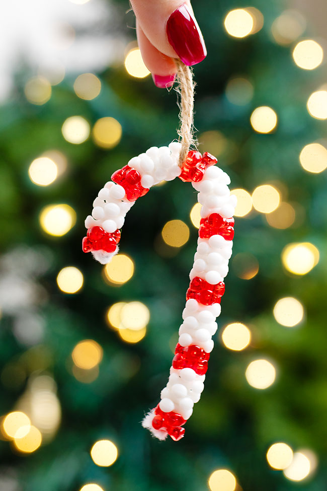 DIY candy cane ornament made with tri-beads and a pipe cleaner