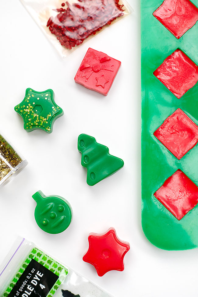 Wax melts shaped like stars, ornaments, presents, and a Christmas tree