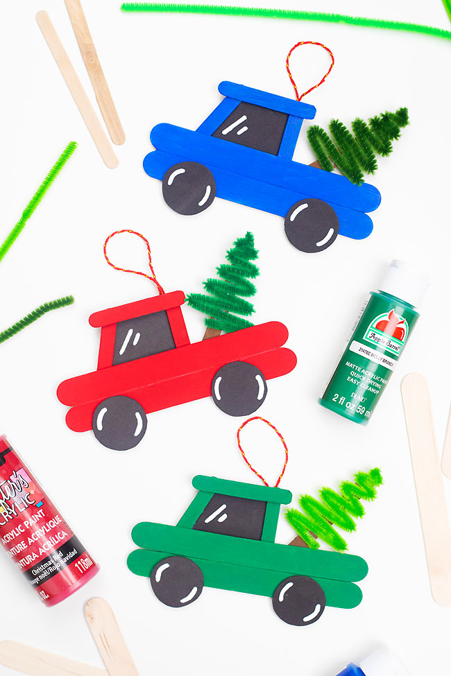 Christmas tree truck ornaments made with popsicle sticks and pipe cleaners