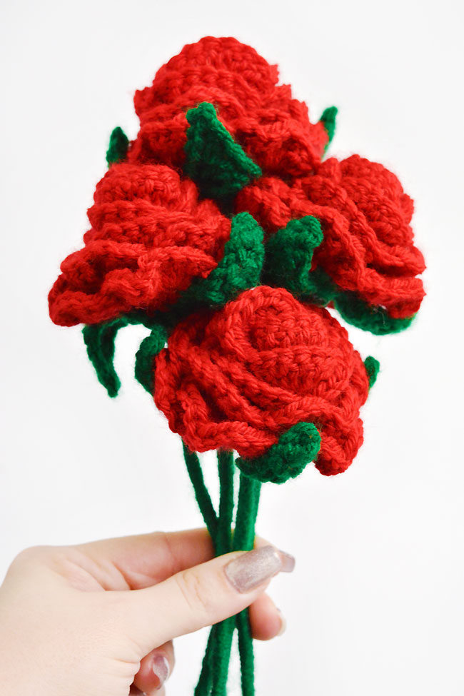 Holding a boquet of crochet roses